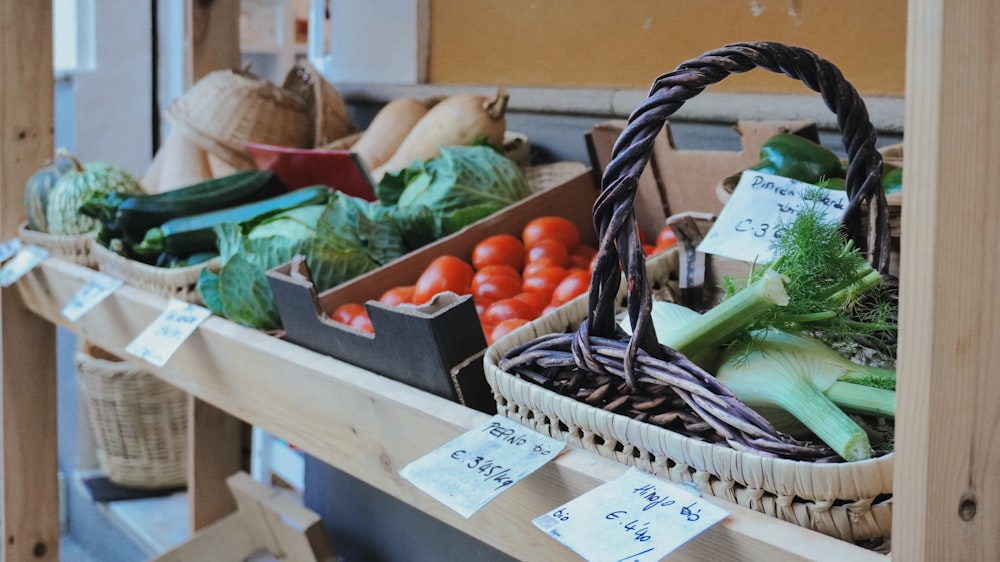 baskets of fresh vegetables are on display at a farmers market