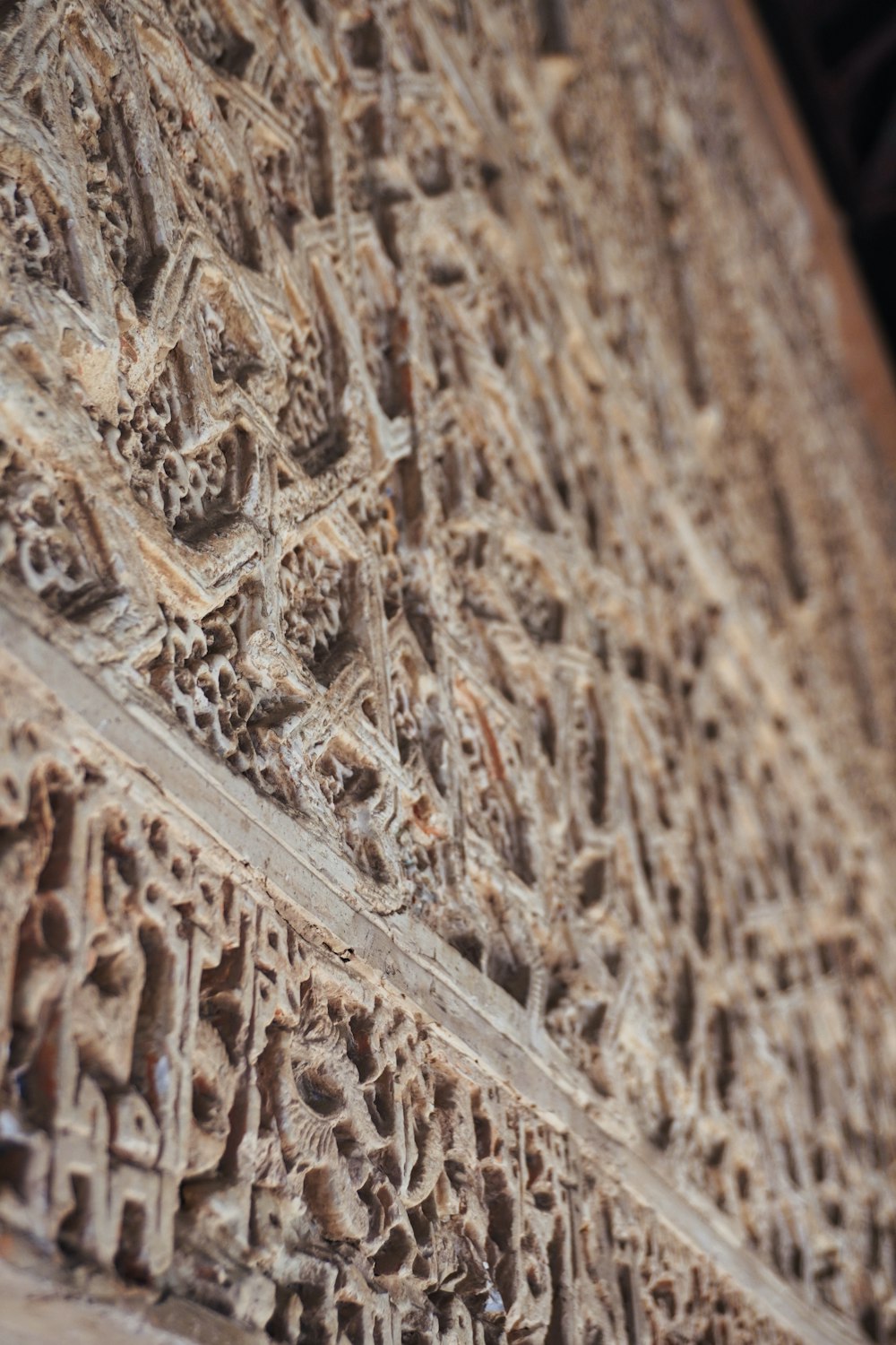 a close up of a carved wooden wall