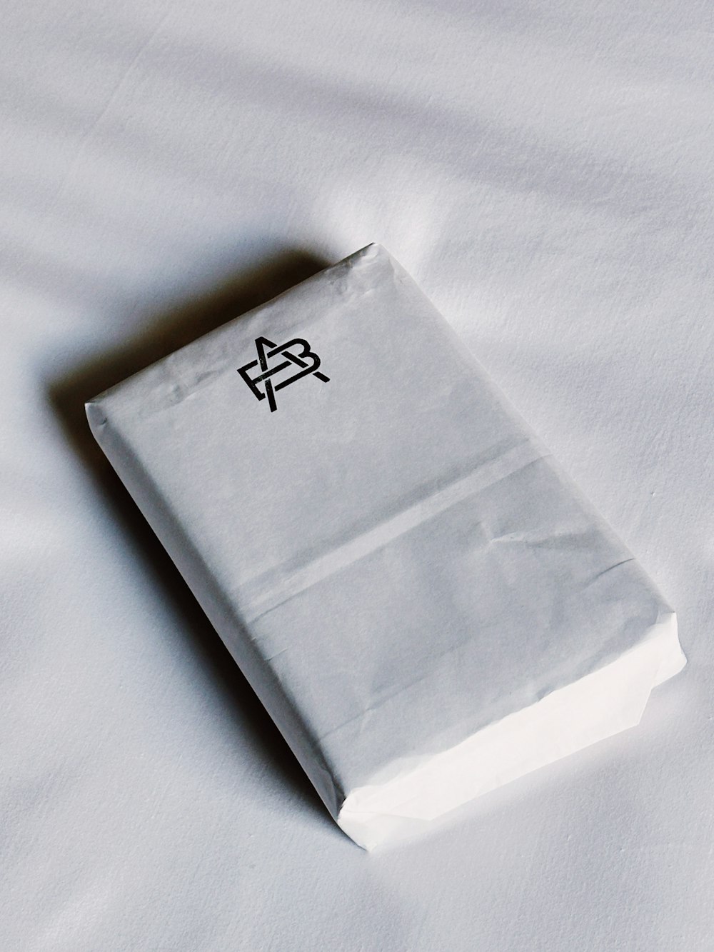 a white paper bag with a chinese writing on it
