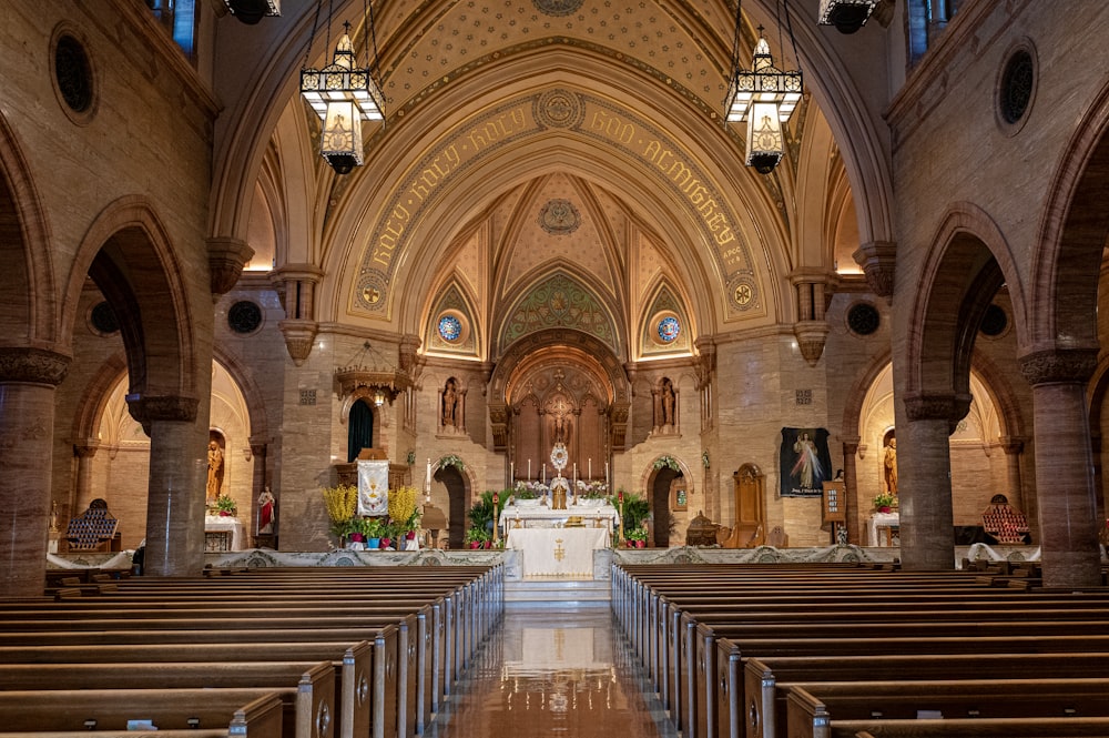 a church with pews and stained glass windows