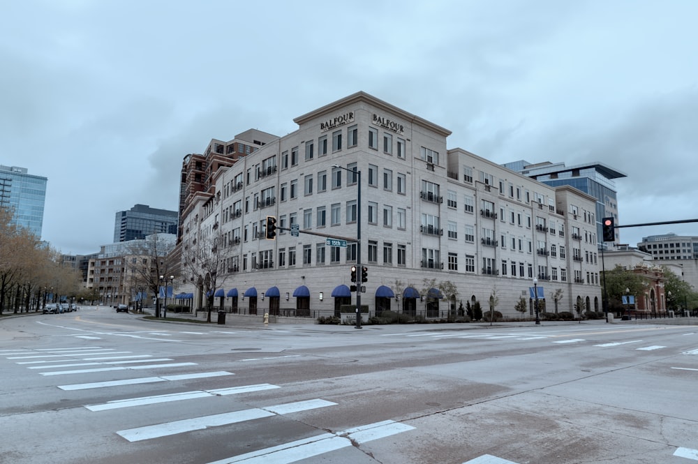 a large white building sitting on the corner of a street