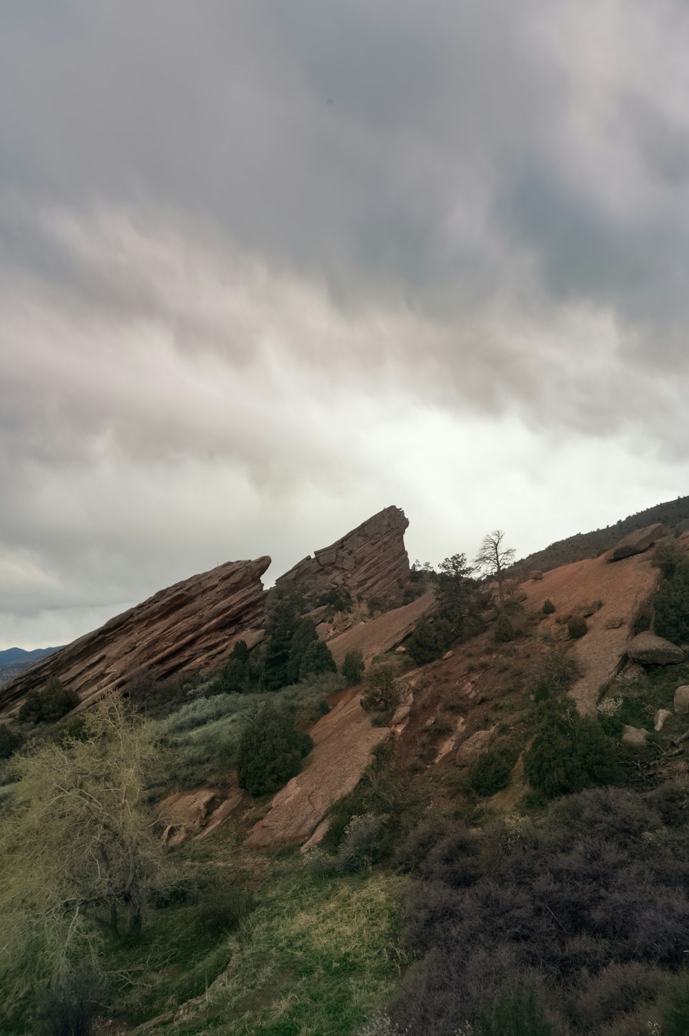 a large rock formation on a cloudy day