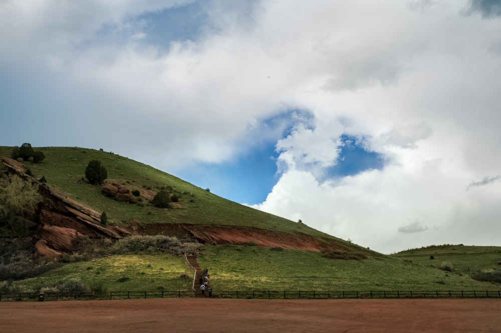 a person riding a bike on a dirt road