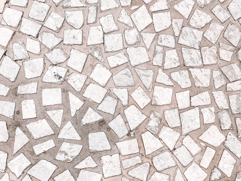 a close up of a white and gray stone floor