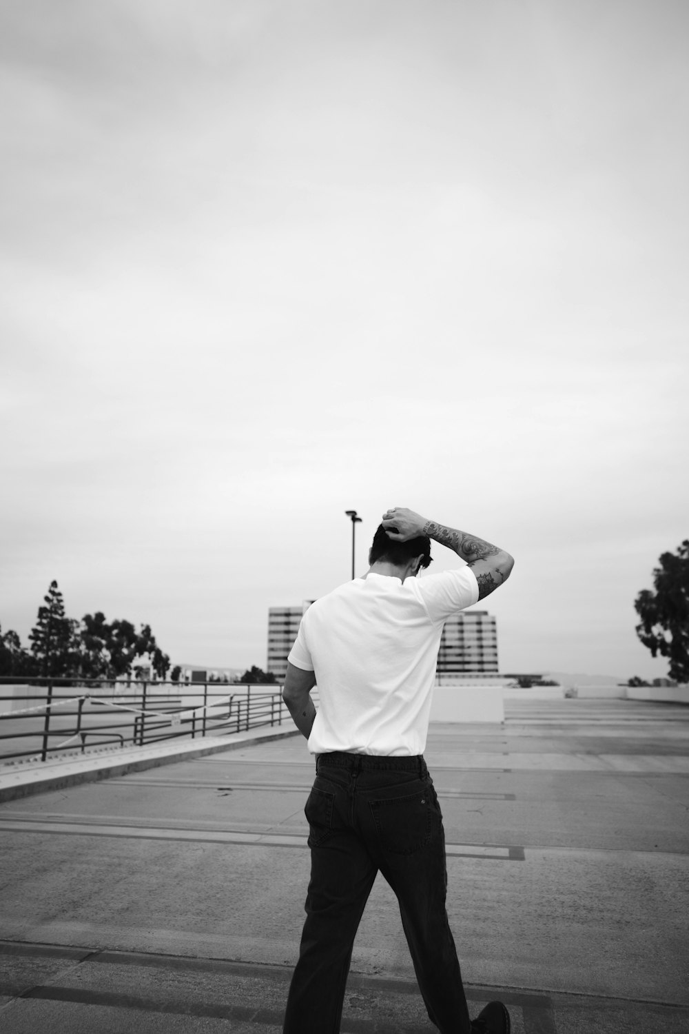 a man in a white shirt and black pants