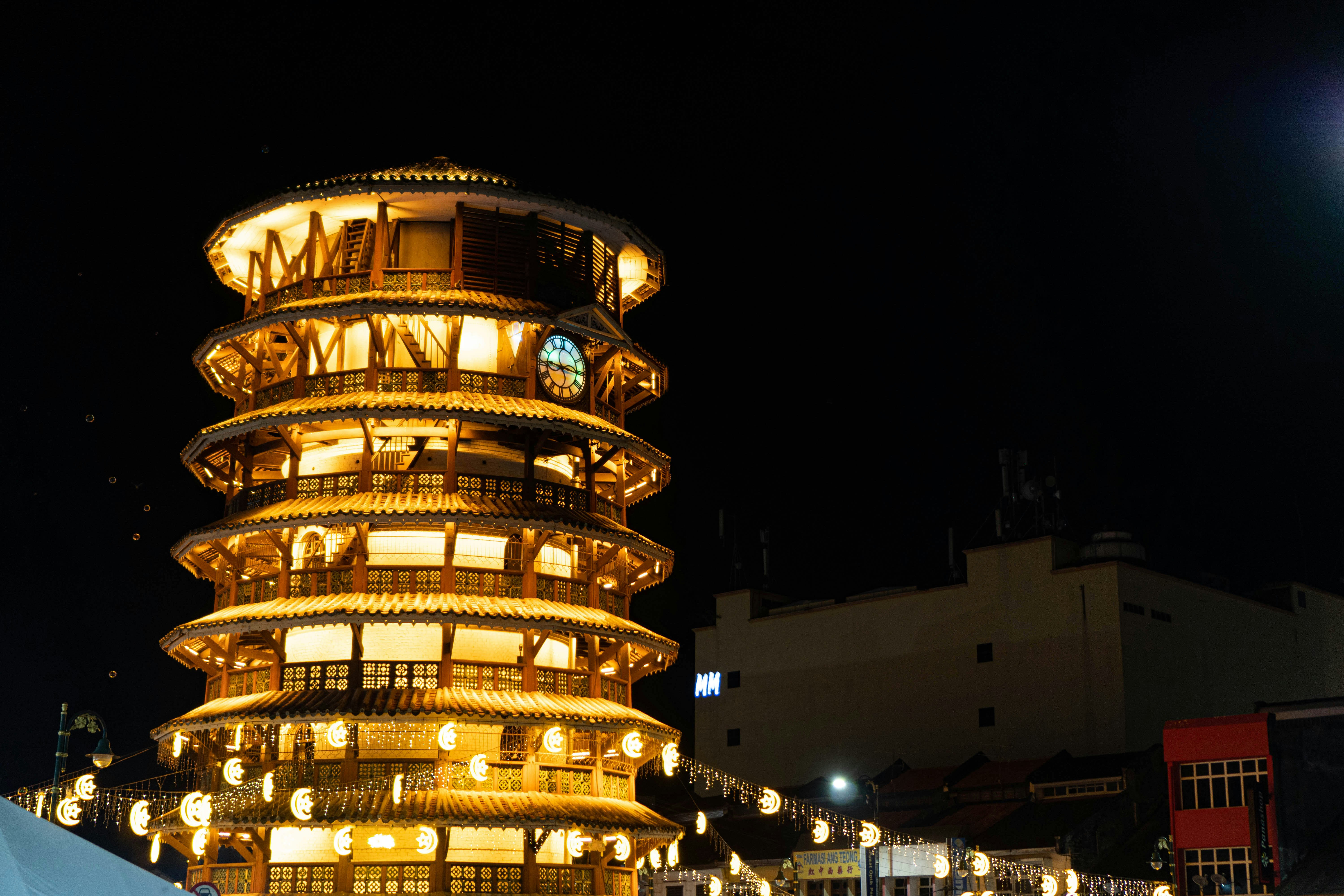 a tall tower with a clock on the top of it