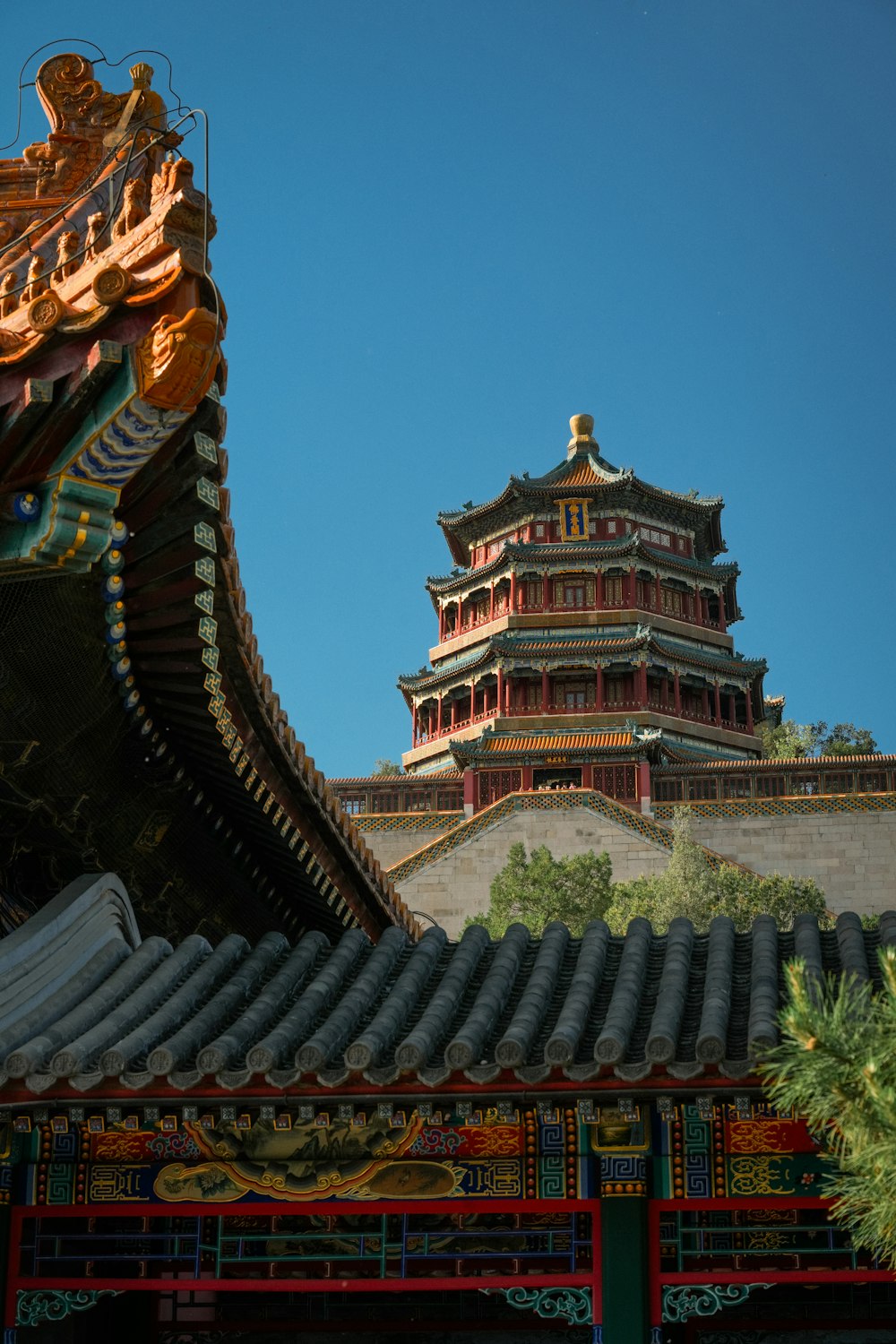 a tall building with a tower in the background