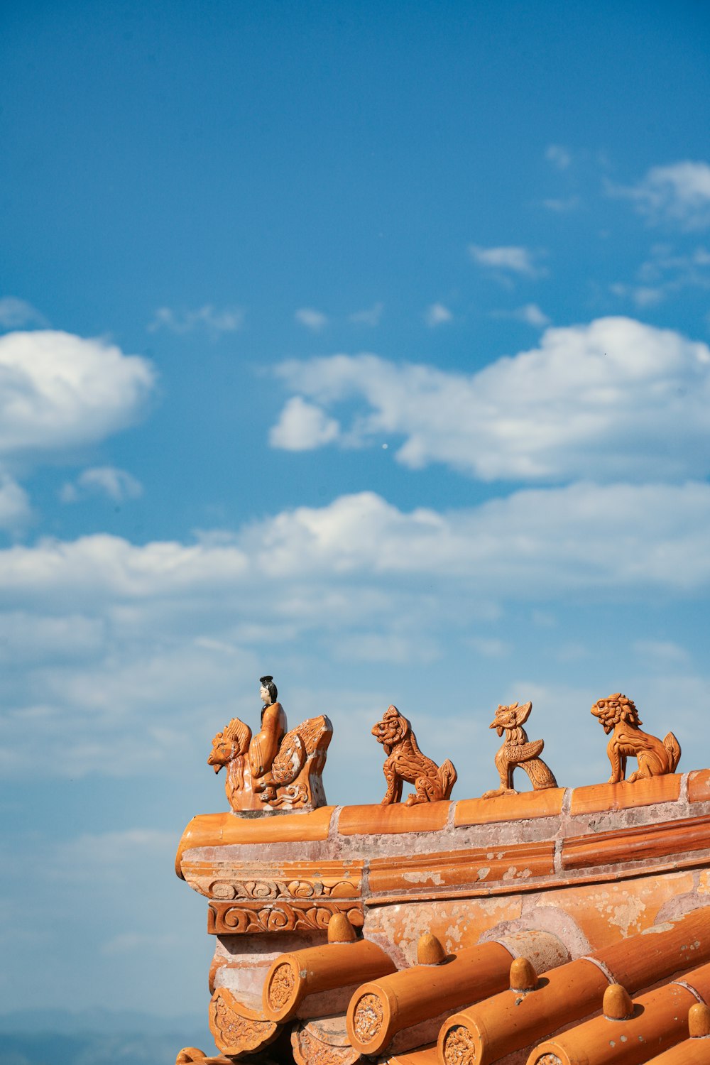 a group of animals sitting on top of a roof