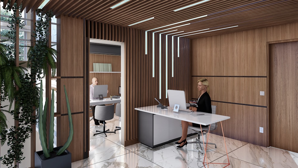 a woman sitting at a desk in an office