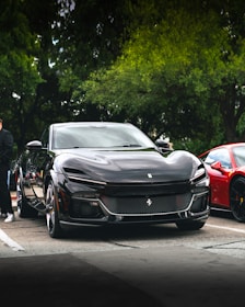 a black ferrari purosangue on a staggered tyre setup offered in lagos nigeria