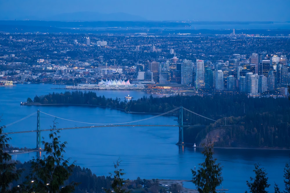 a view of a city and a bridge at night