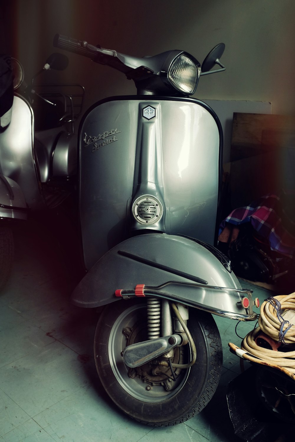 a motor scooter is parked in a garage