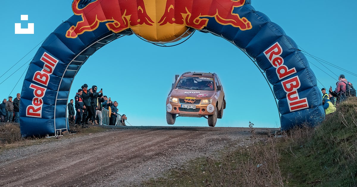 A red bull rally car going through an arch photo – Free Suzuki Image on ...