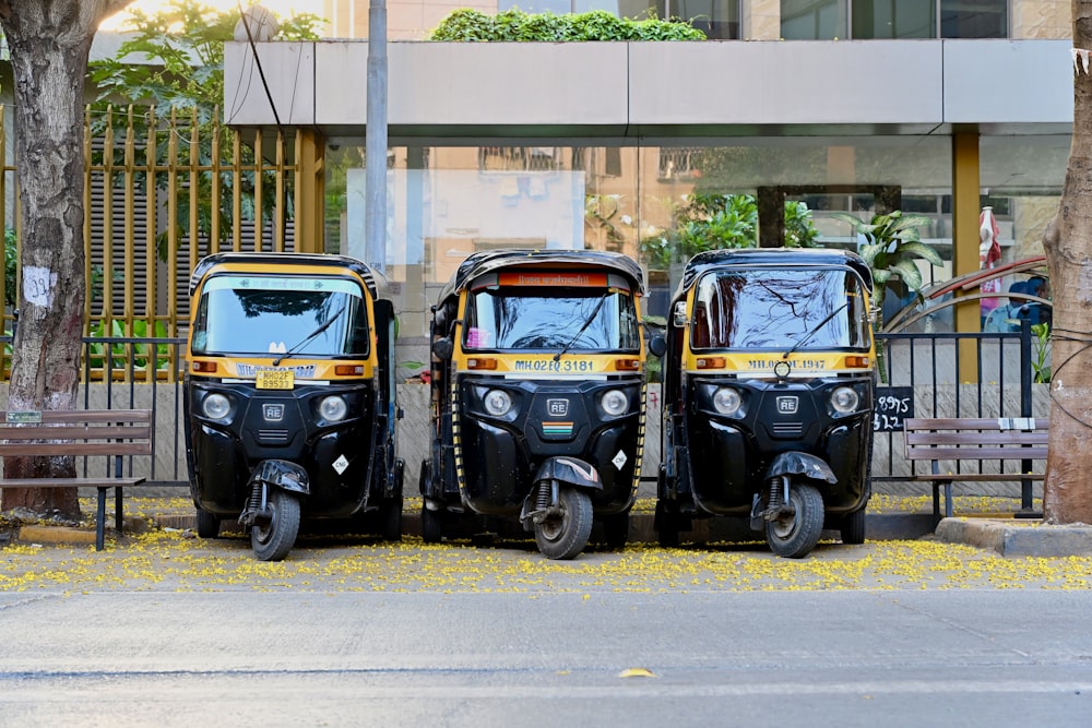 three motorcycles parked next to each other in front of a building