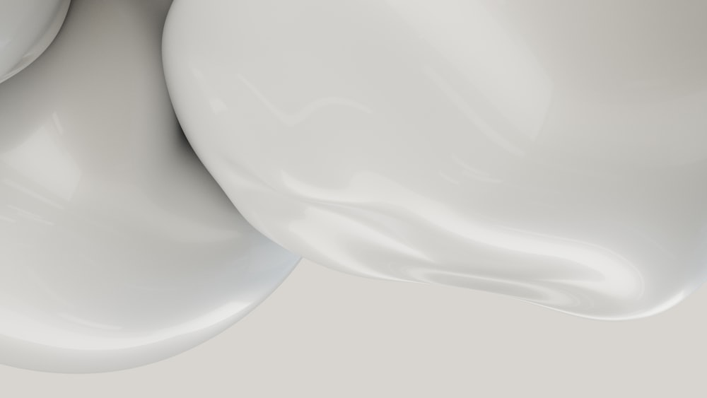 a close up of a white object with a gray background