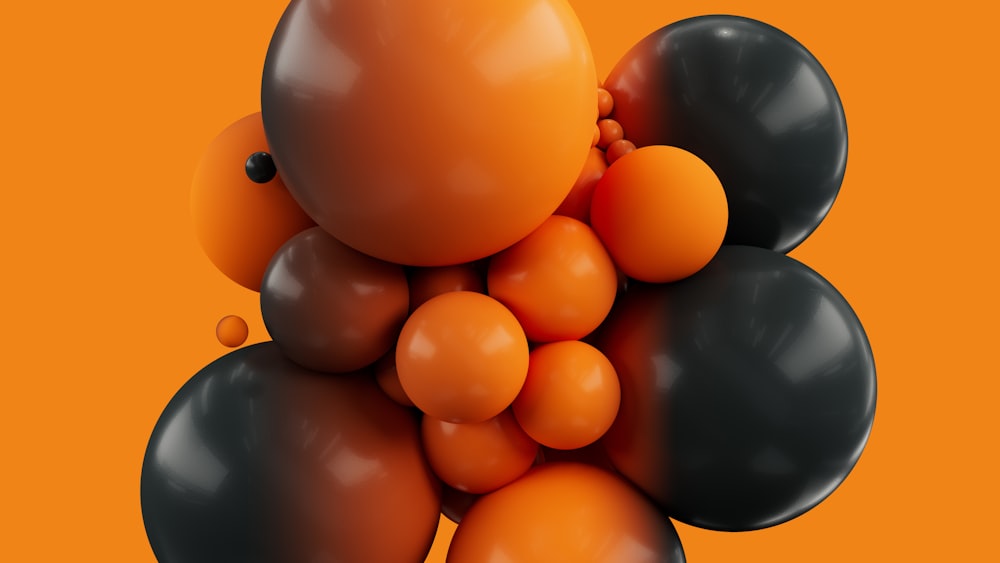un mazzo di palloncini neri e arancioni su sfondo arancione