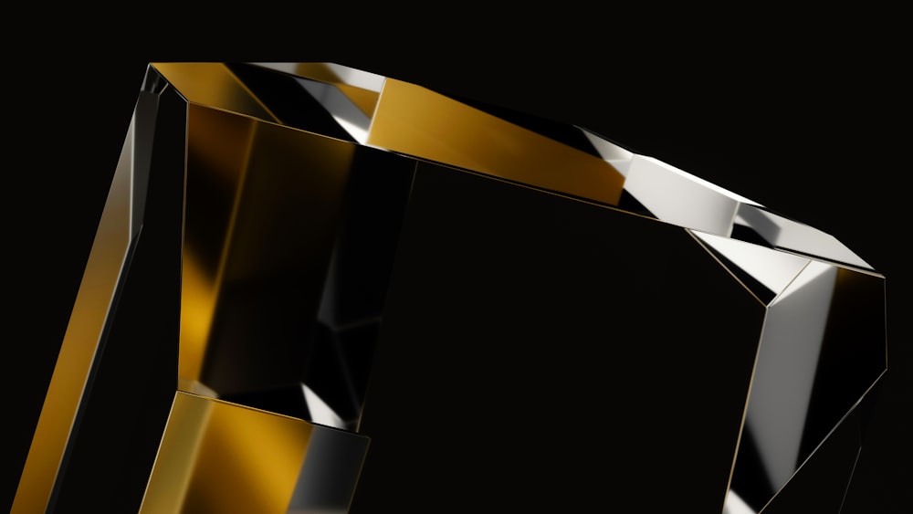 a black and gold object with a black background