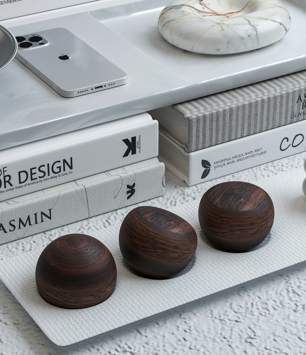 a group of three wooden balls sitting on top of a table