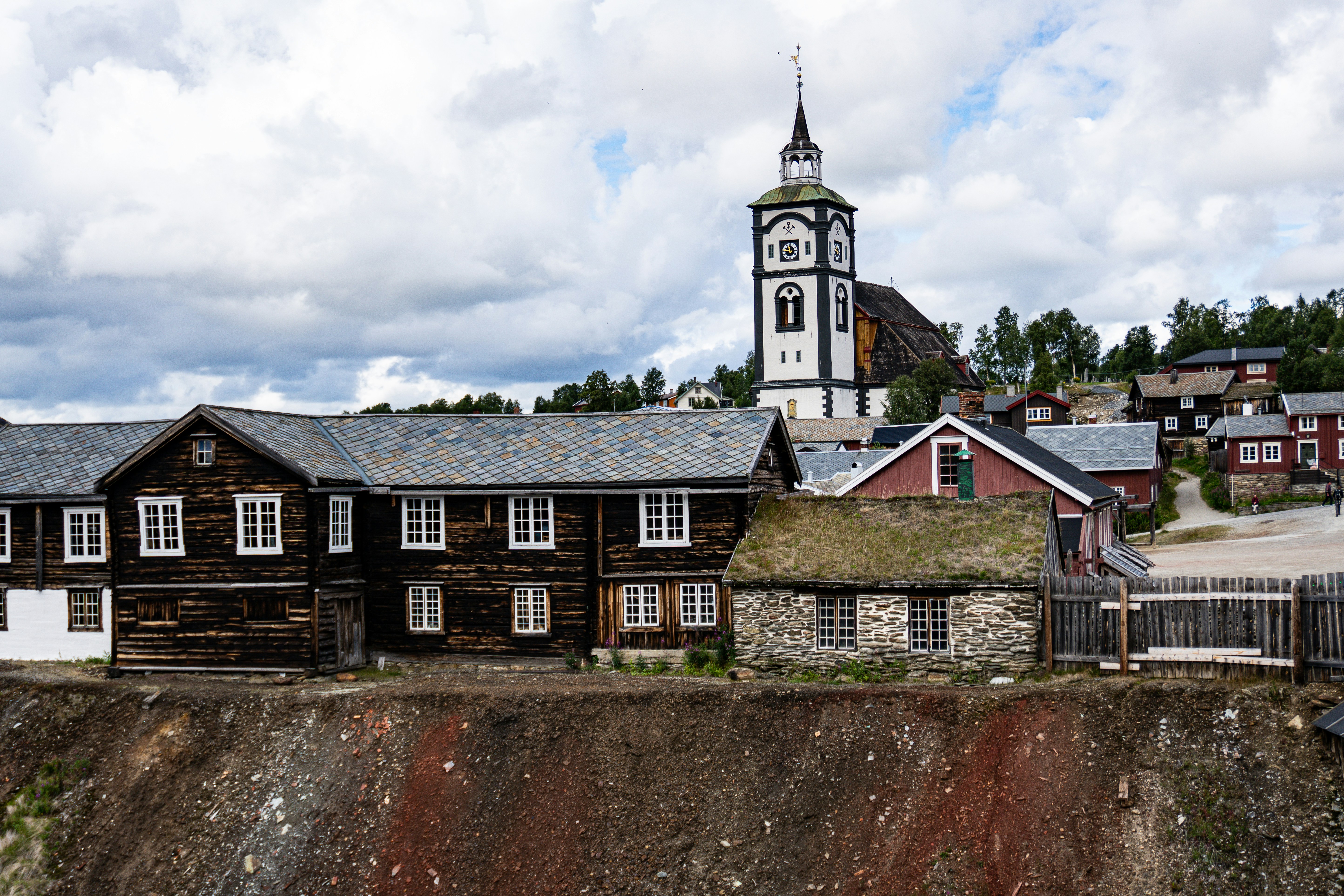 a large wooden building with a steeple on top of it