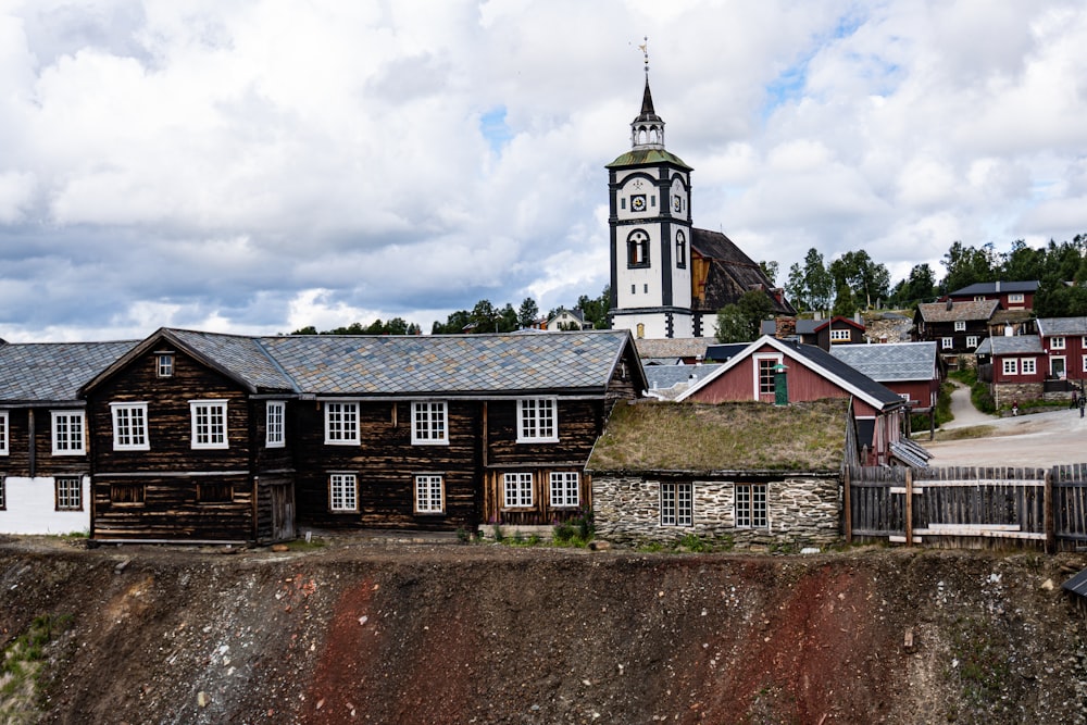 a large wooden building with a steeple on top of it