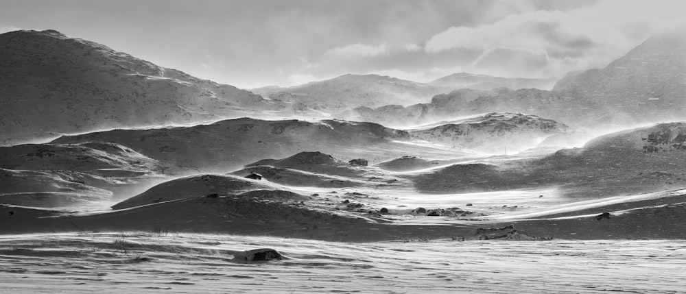 a black and white photo of a mountain range