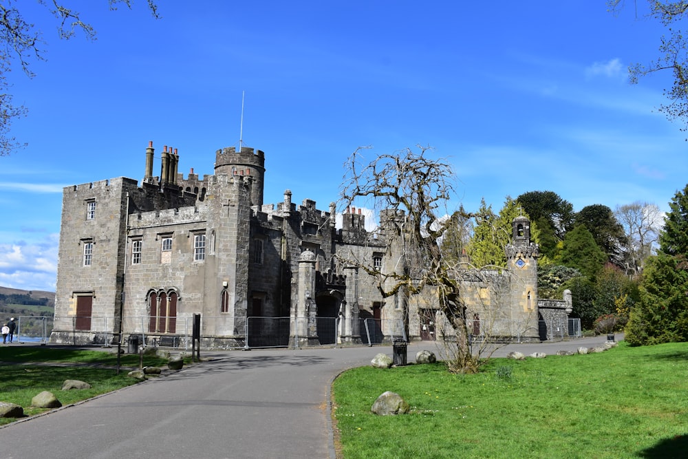 an old castle with a walkway leading to it