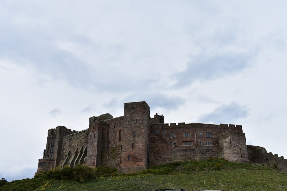 a car is parked in front of a castle