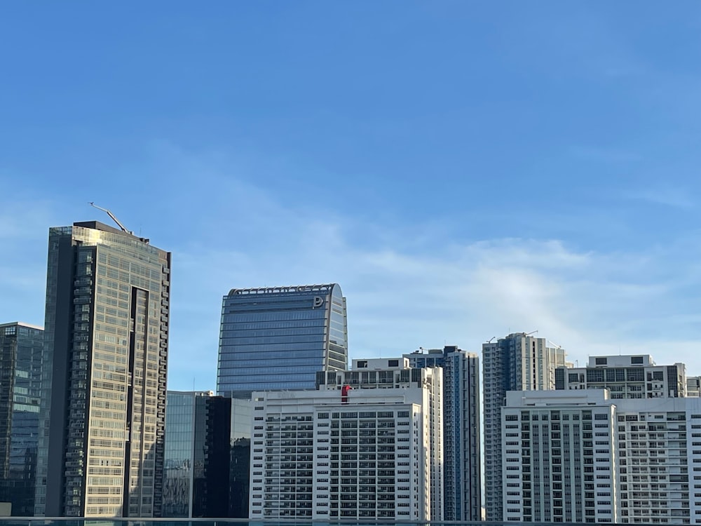 a large body of water in front of tall buildings