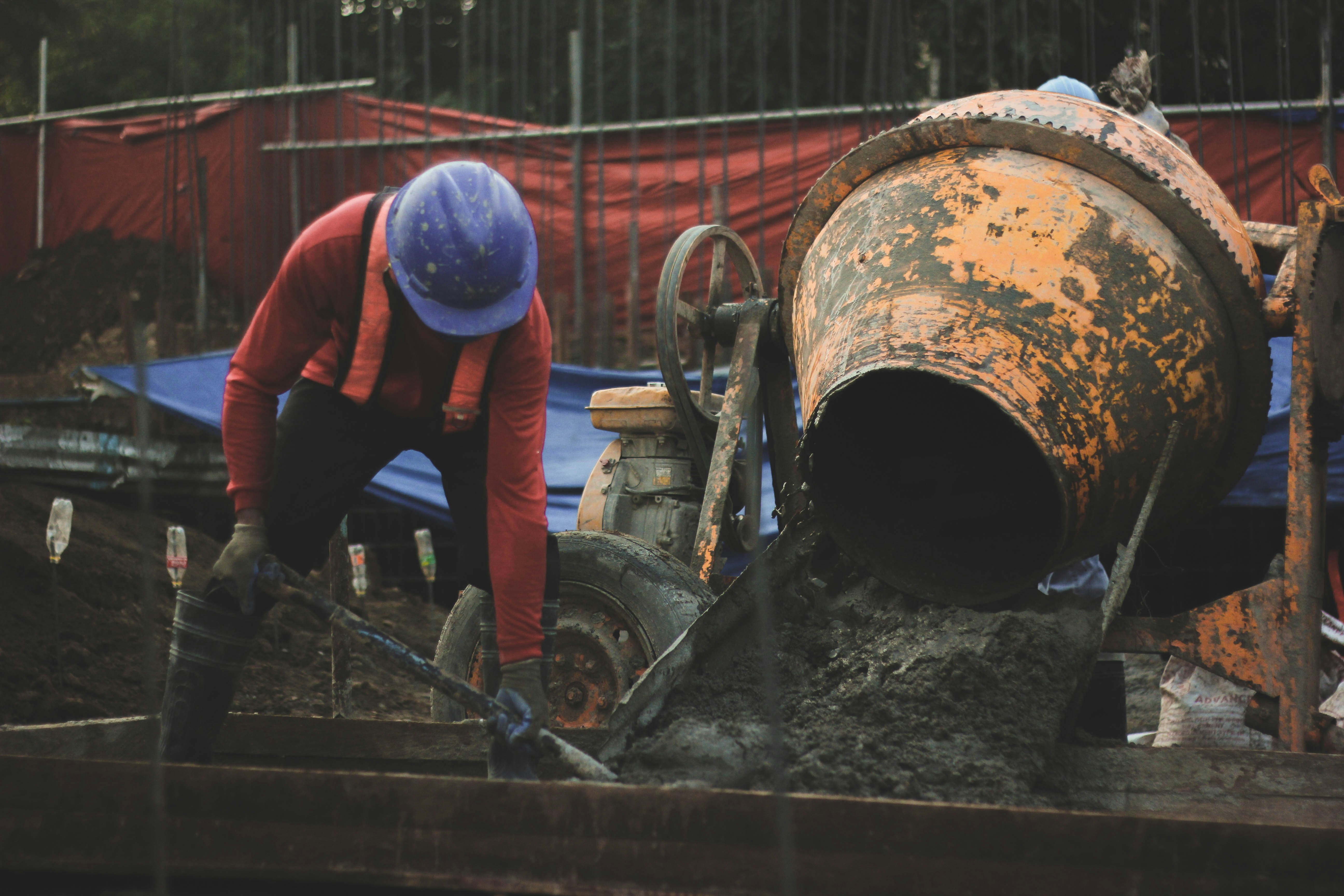 workers repairing a pipe leak with proper tools and safety equipment - industrial water conservation