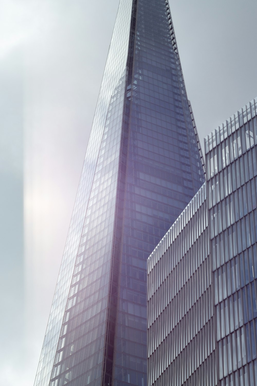 a very tall building with a sky background