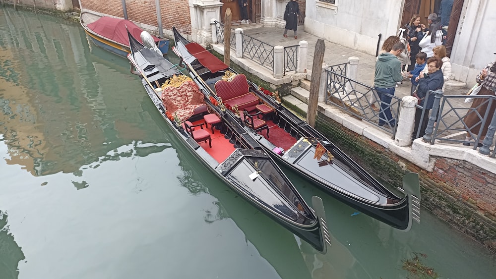 a couple of gondolas that are sitting in the water