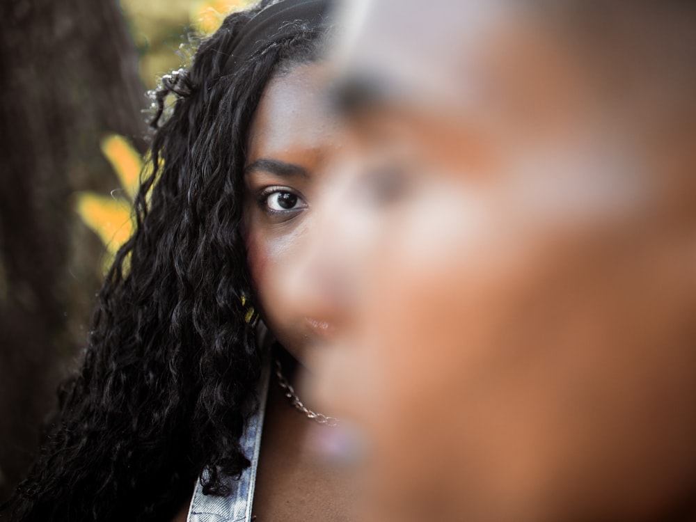 a close up of a person with long hair