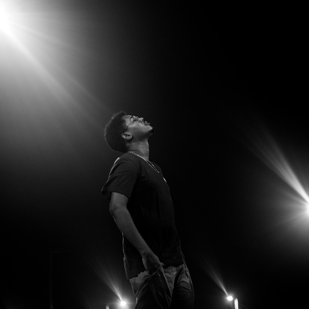 a man standing in the middle of a dark room