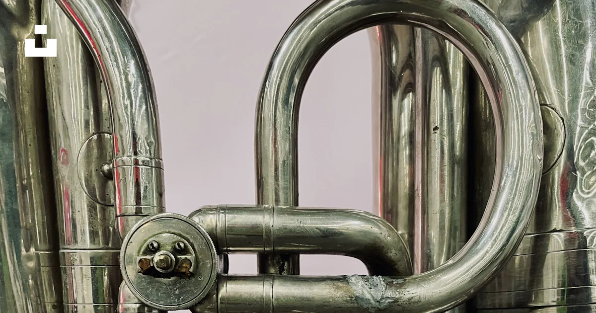 A close up of a silver instrument with many pipes photo – Free Trumpet ...