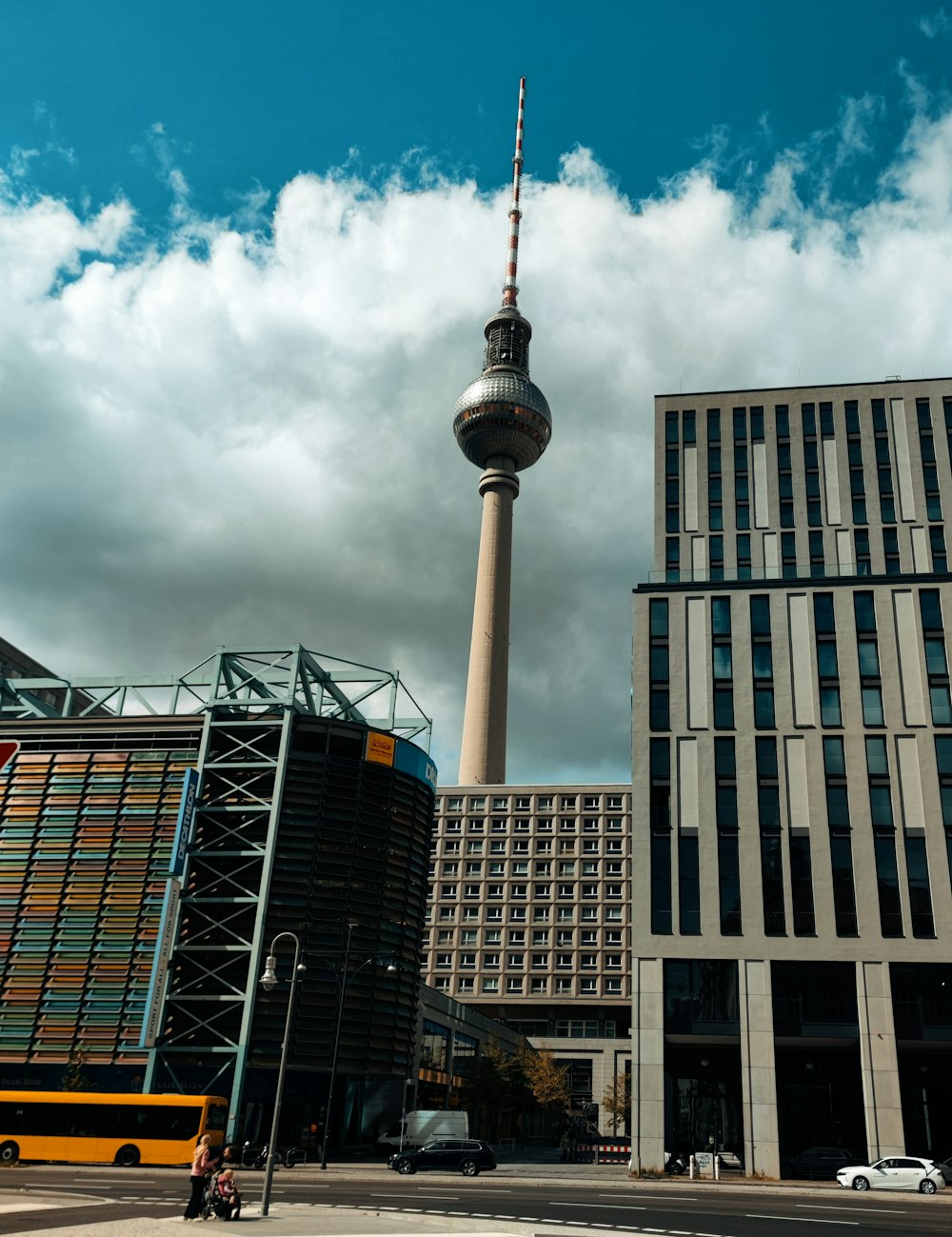 a tall building with a tv tower in the background