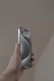 a person holding a cell phone in their hand