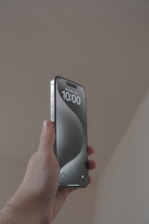 a person holding a cell phone in their hand