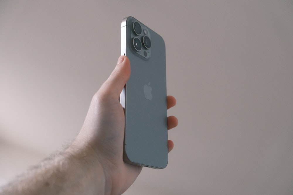 a person holding an iphone in their hand