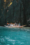 a long boat in the middle of a body of water