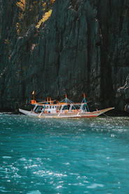 a long boat in the middle of a body of water