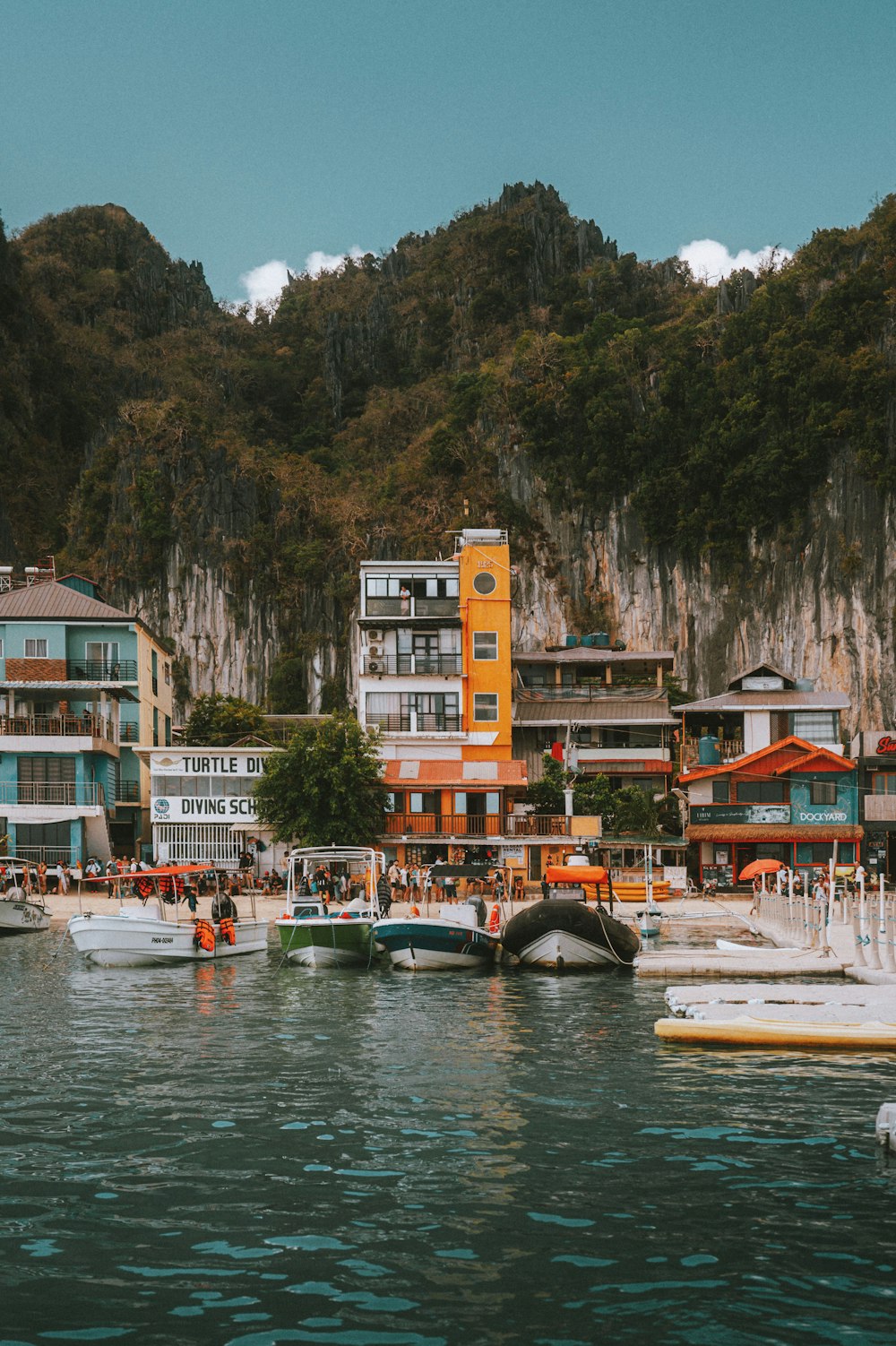 a group of boats floating on top of a body of water