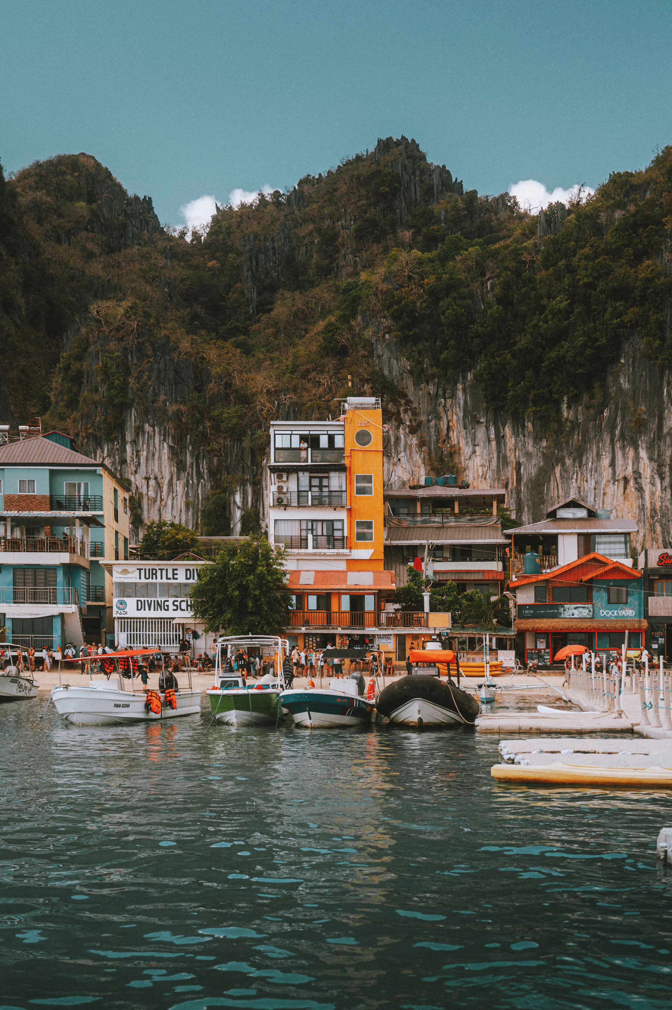 Life jackets hanging in a row on a wooden outrigger boat