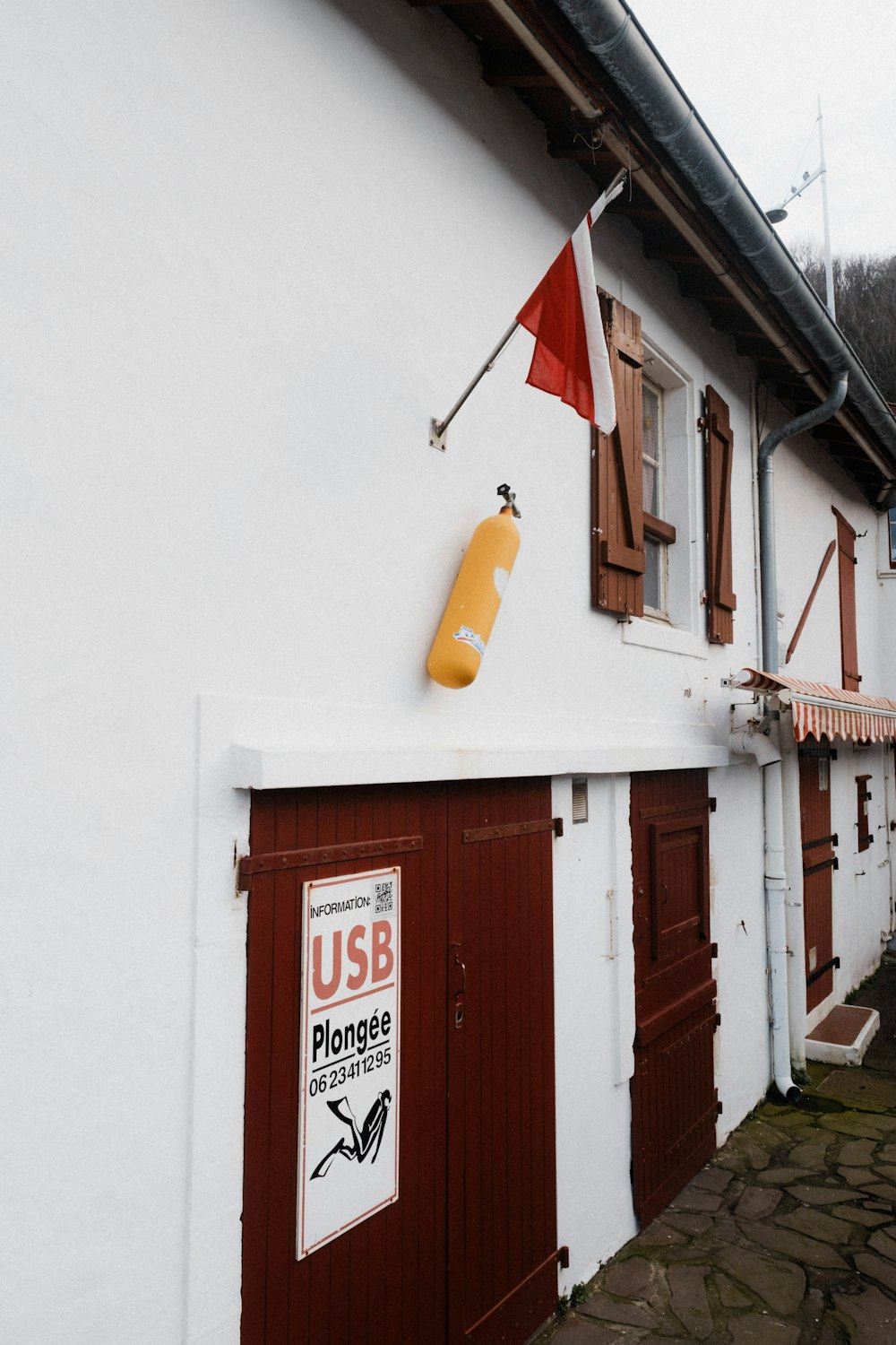 a red and white building with a sign on it