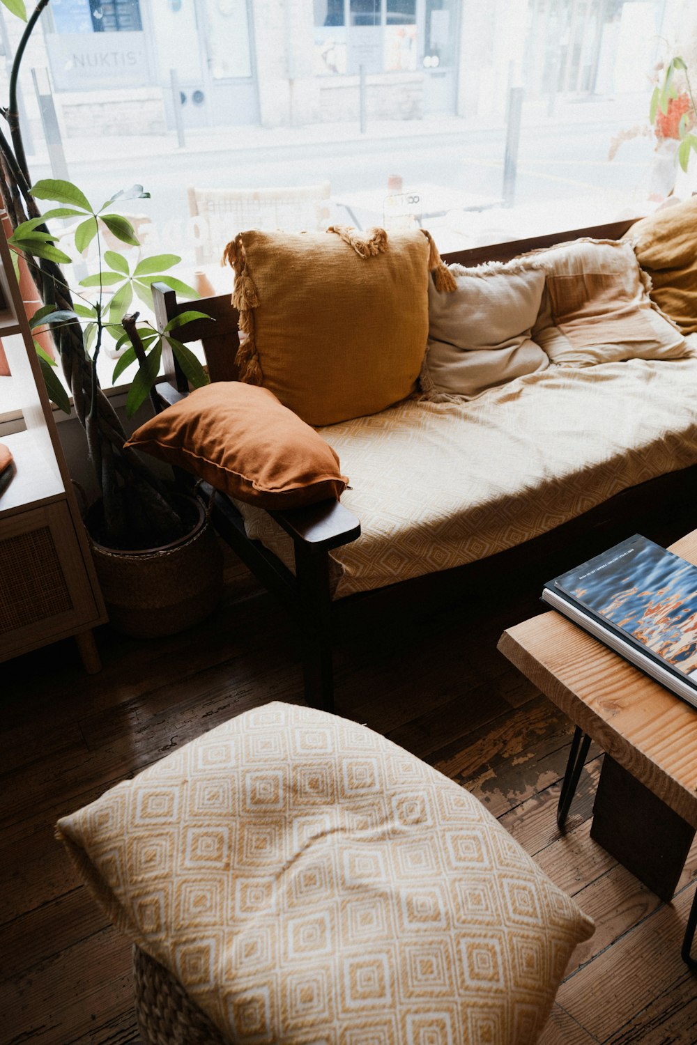 a living room filled with furniture and a large window