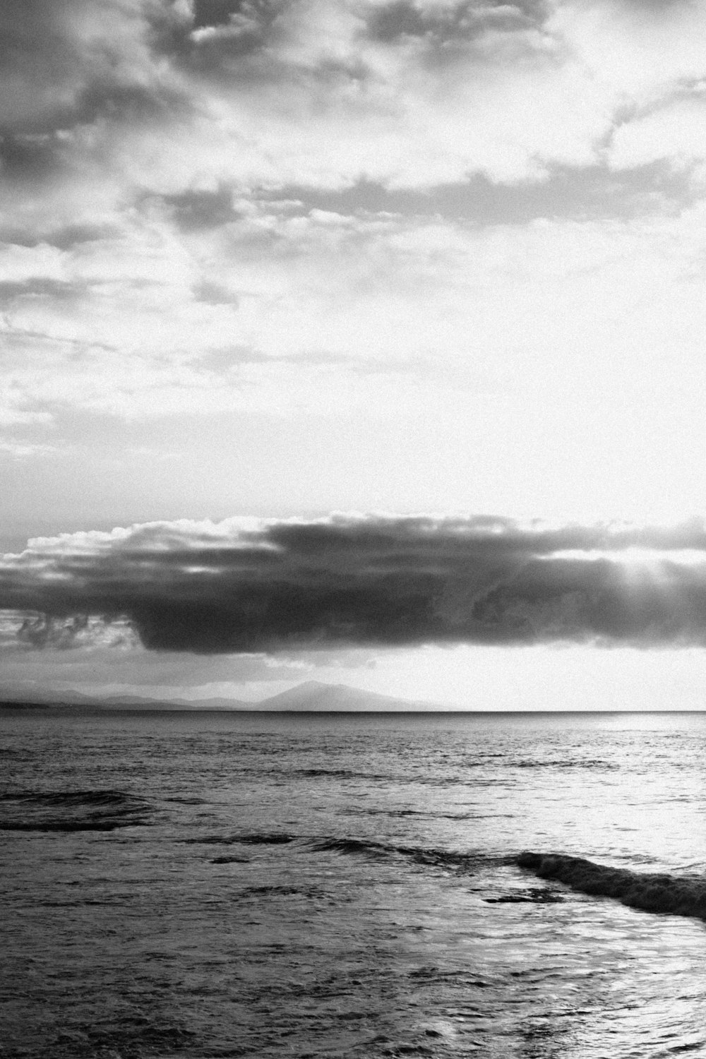 a black and white photo of the ocean