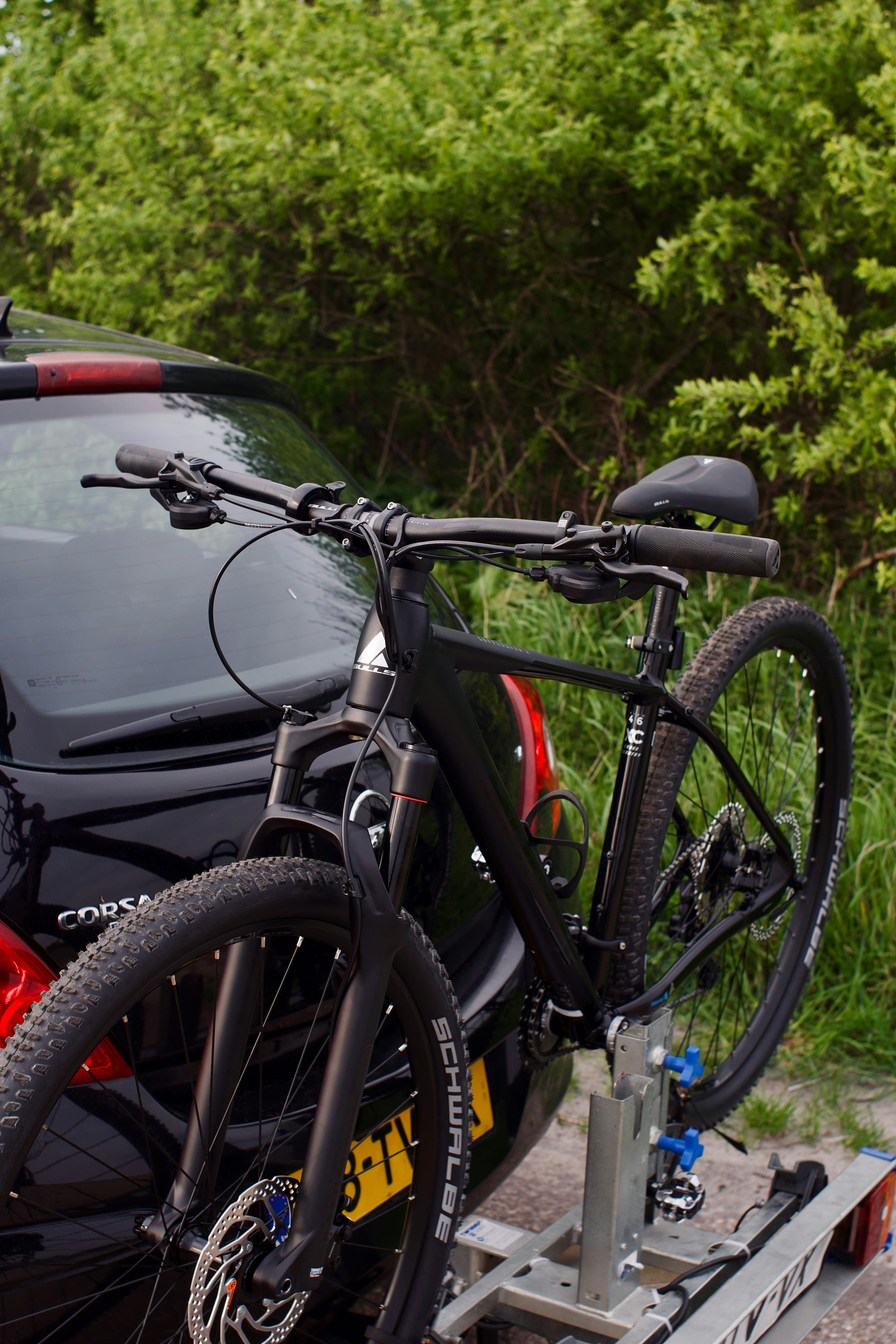 a car with a bike on the back of it