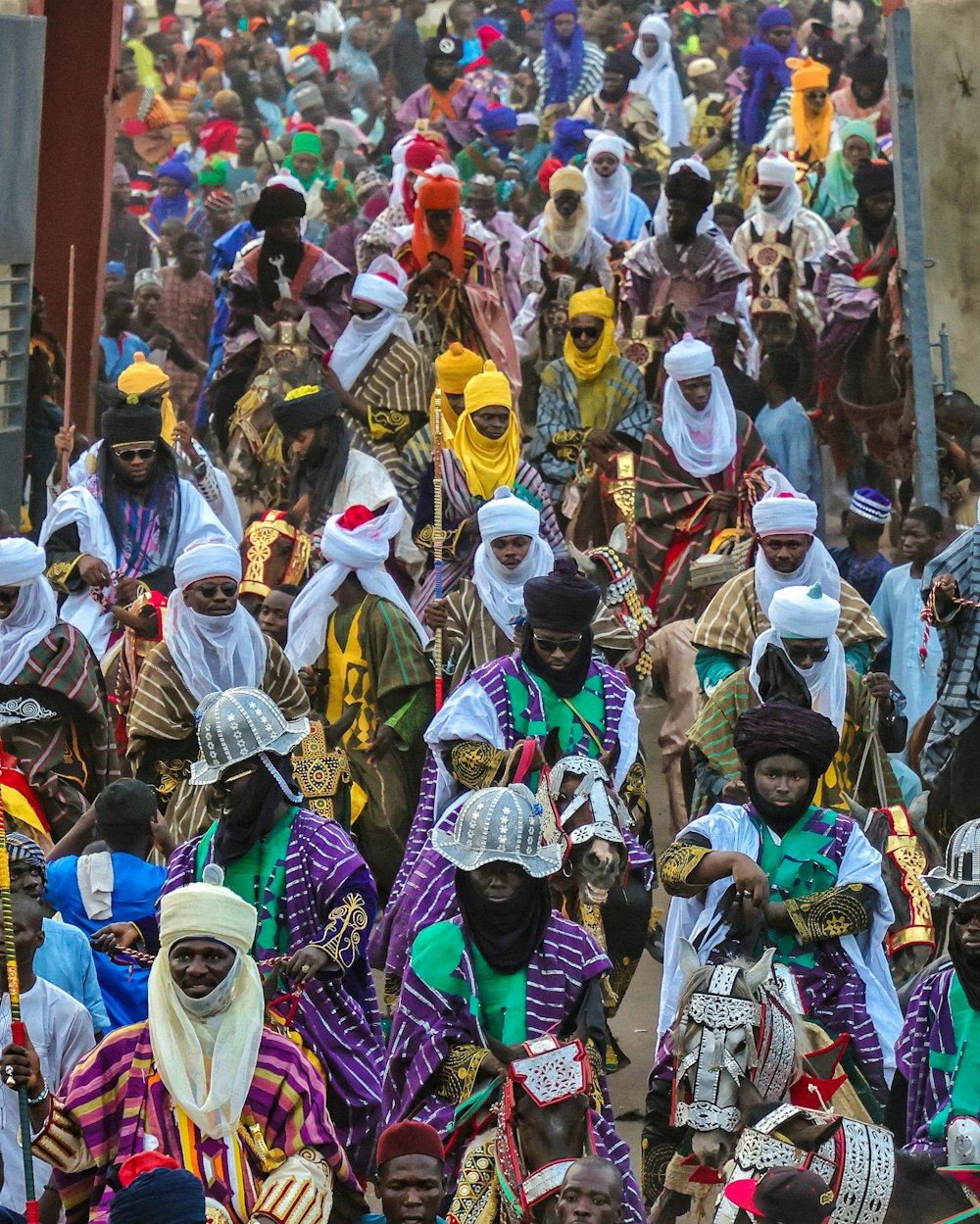 a large group of people walking down a street