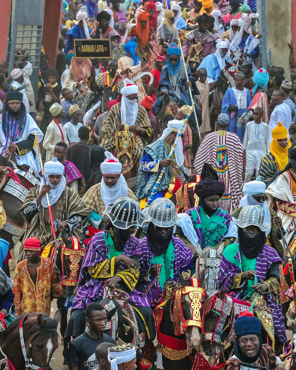 a large group of people walking down a street