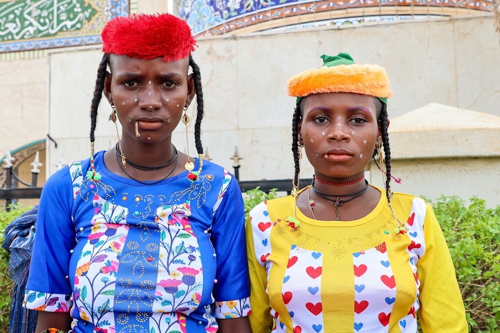 a couple of women standing next to each other