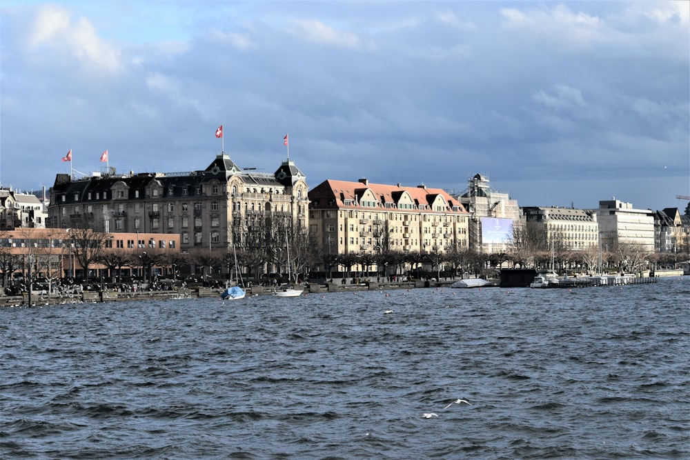 a body of water with a large building in the background